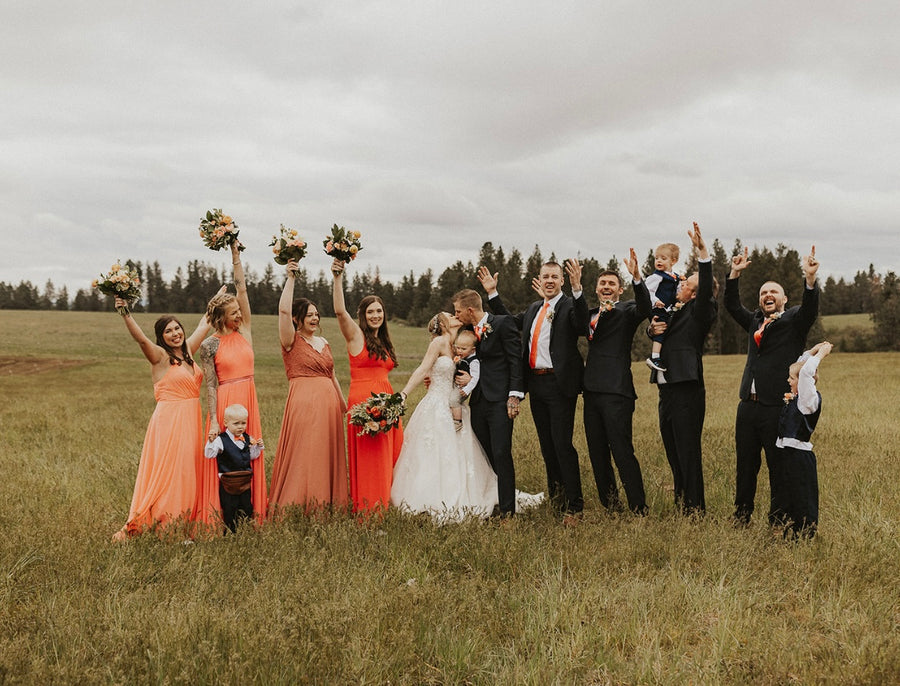 Peach wedding theme with cream and peach wedding florals from Daisies in May Spokane florist