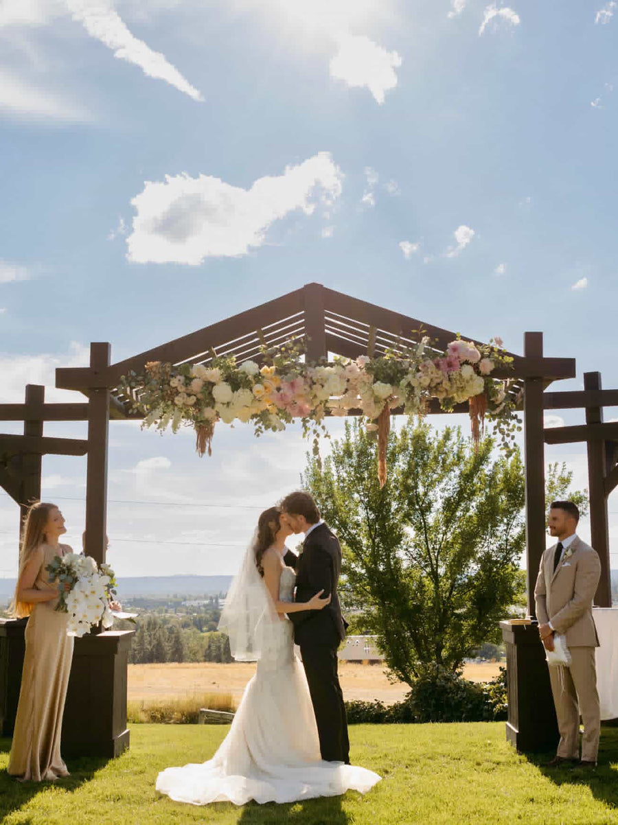 Beacon Hill in Spokane, WA with floral arrangement with Dahlias and roses crafted by Daisies in May wedding florist.