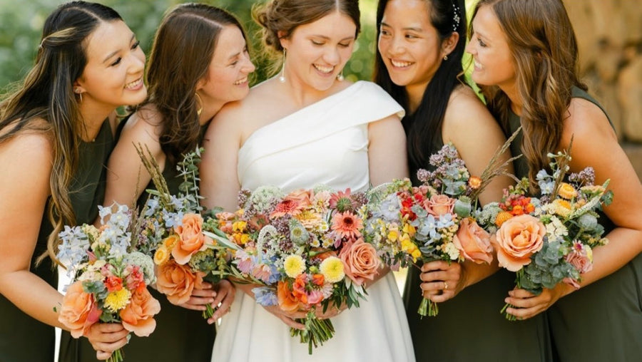 Bold wildflower bridal and bridesmaid bouquets for an beautiful outdoor wedding
