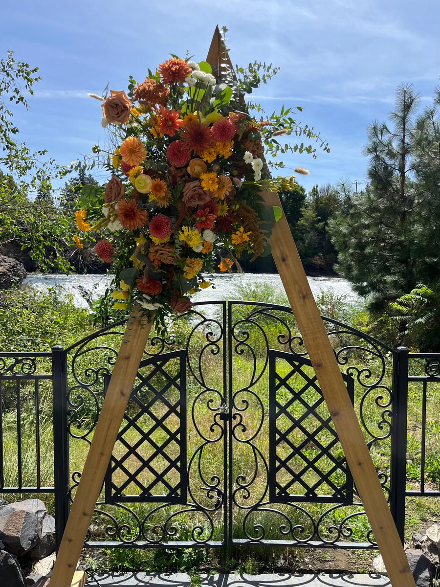 Bold fall wildflower arbor arrangement for an autumn wedding in Spokane, WA