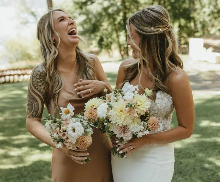 Neutral wedding bouquets for an outdoor wedding. Soft florals are created by Daisies in May wedding florist