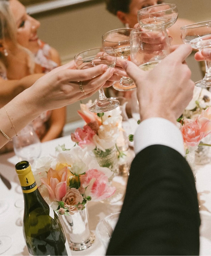 Wedding toast with gorgeous pink and white florals from Daisies in May florist in Spokane