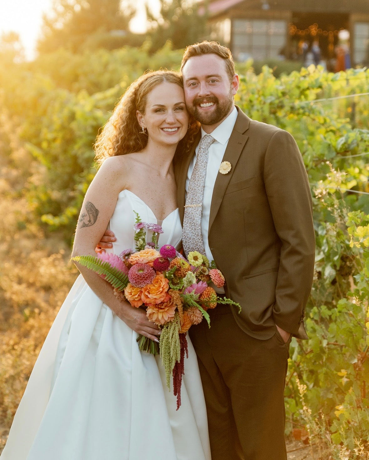 Citrus bridal bouquet, with bride and groom. Bouquet created by Daisies in May
