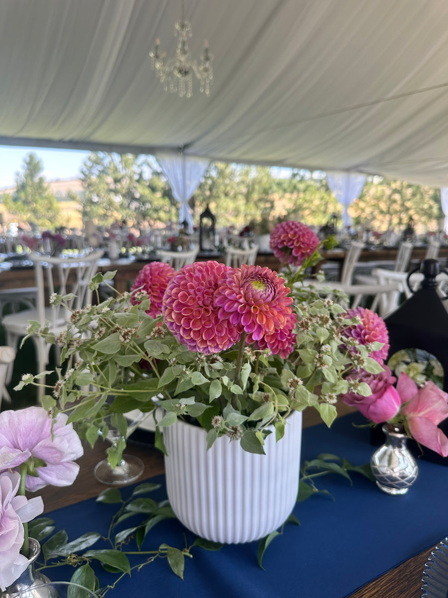 Bouquet of pink and green flowers with a blurred background