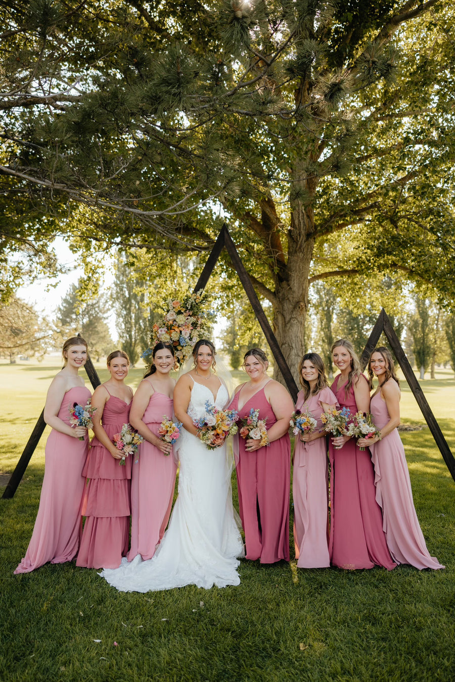 Dusty rose and blush themed wedding with beautiful wildflower pastel bouquets by Spokane wedding florist Daisies in May