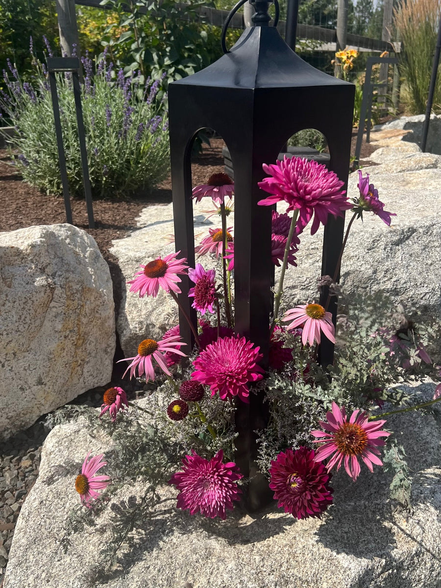 Black lantern with pink flowers created a beautiful touch to this outdoor wedding in Spokane, WA