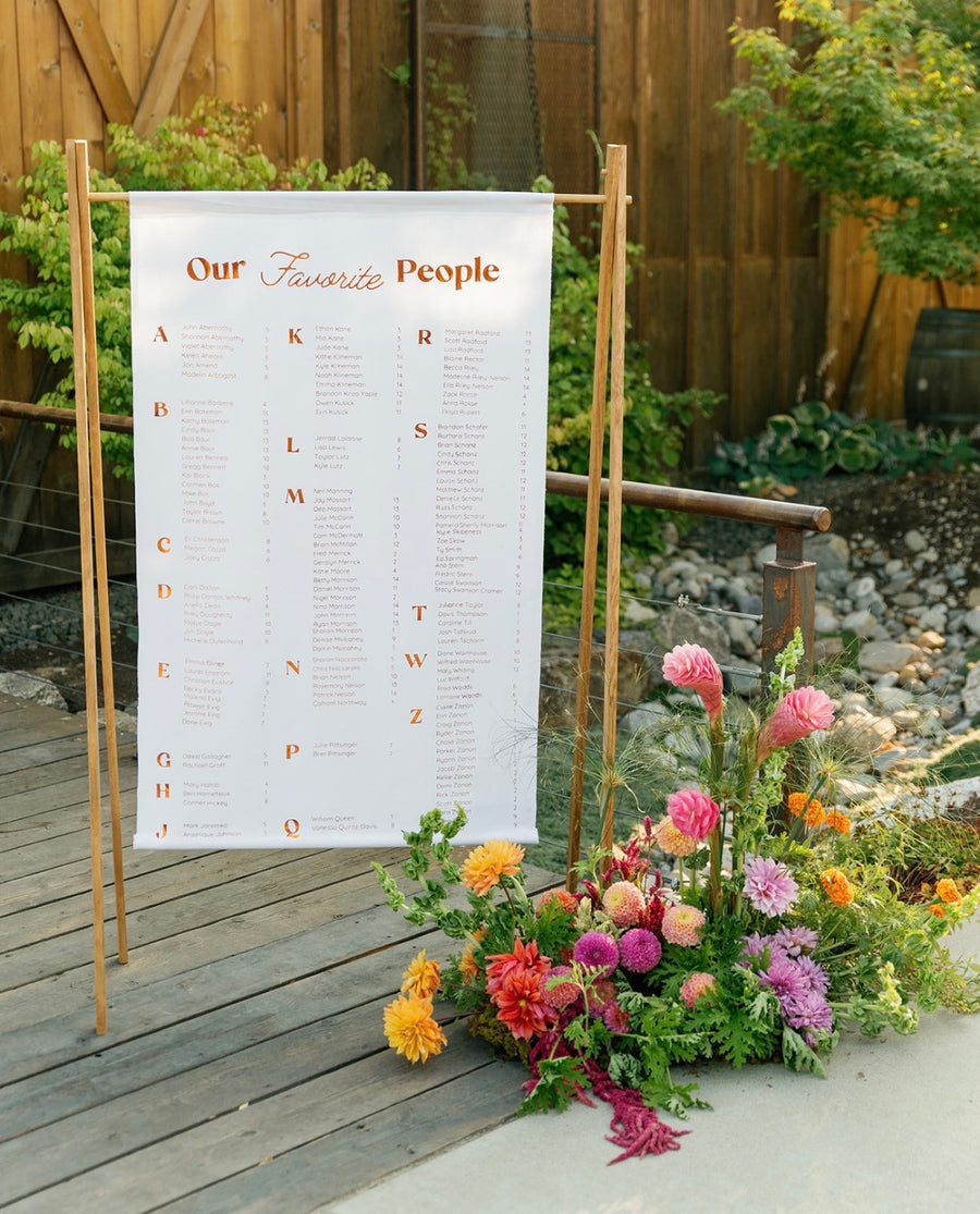 Seating chart is decorated with an autumn floral arrangement for this gorgeous rustic wedding.