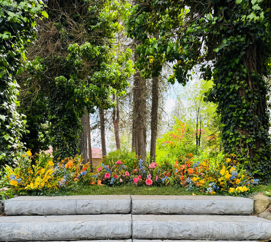 Grounded arch of wildflowers at Arbor Crest Winery in Spokane, WA. Wildflowers are crafted by Daisies in May flower farm in Spokane, WA