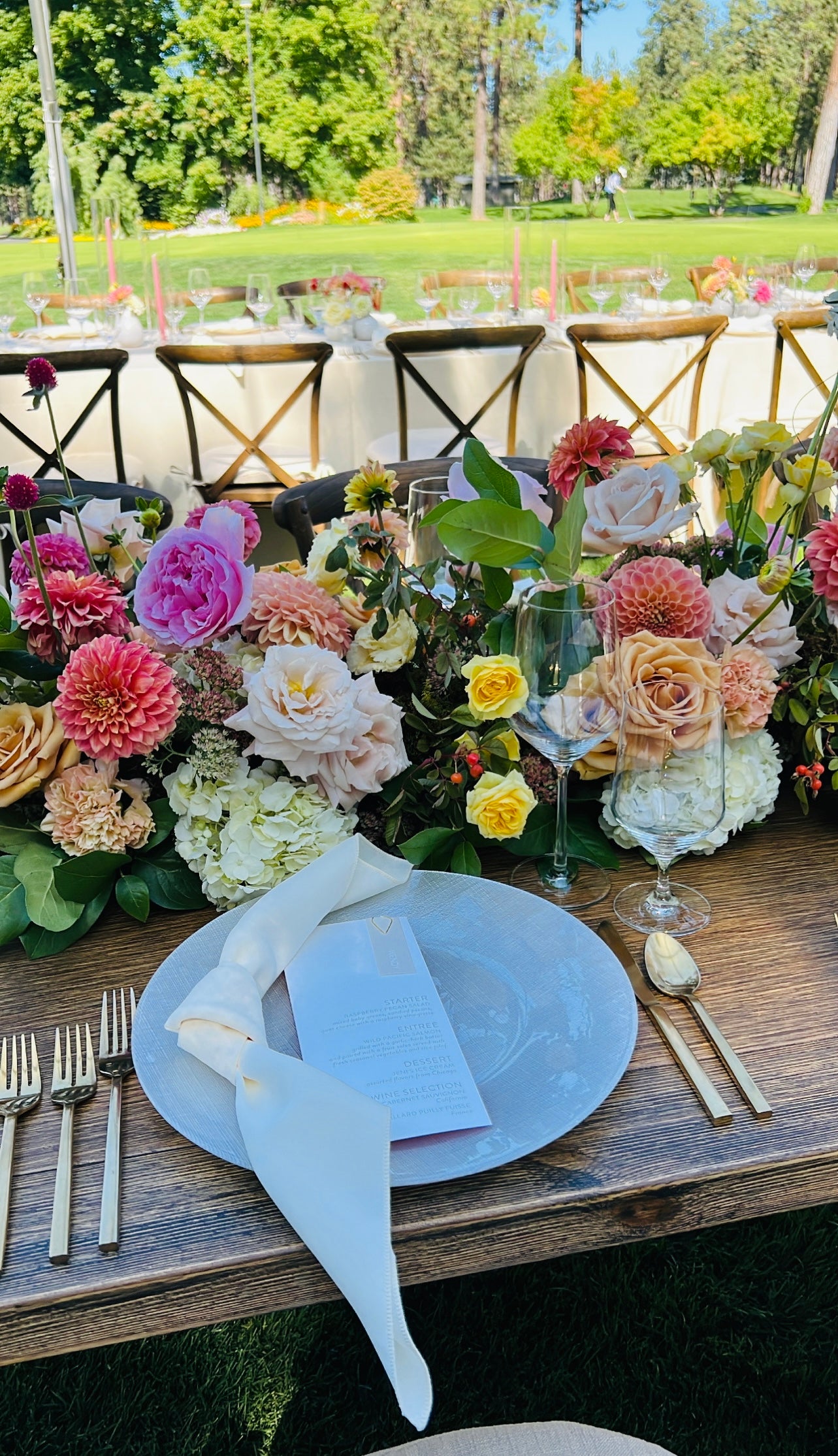 Spokane, Washington wedding reception with lush floral centerpieces by Daisies in May
