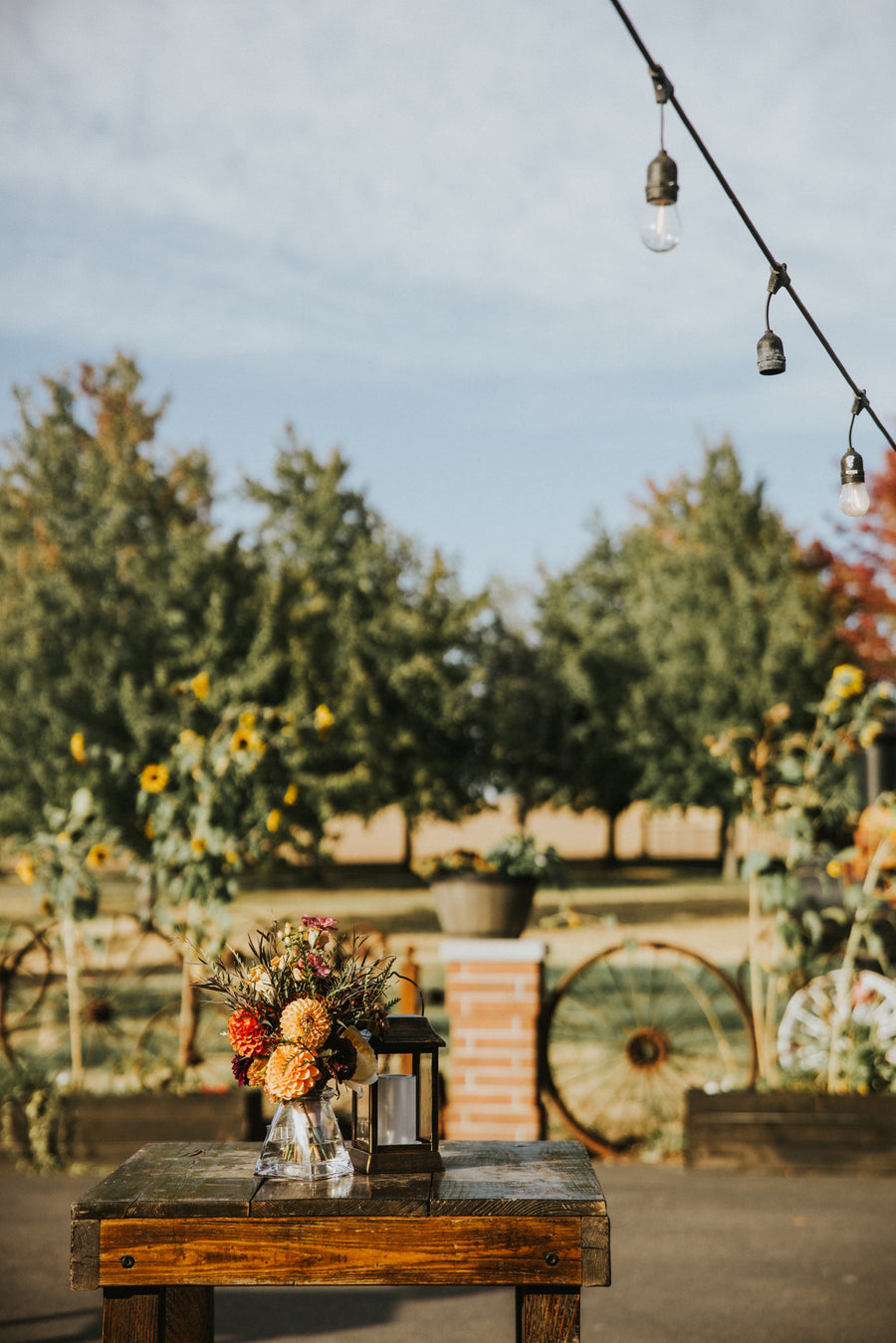 Hightop farm tables in Spokane, Washington with flowers that are beautiful autumn shades