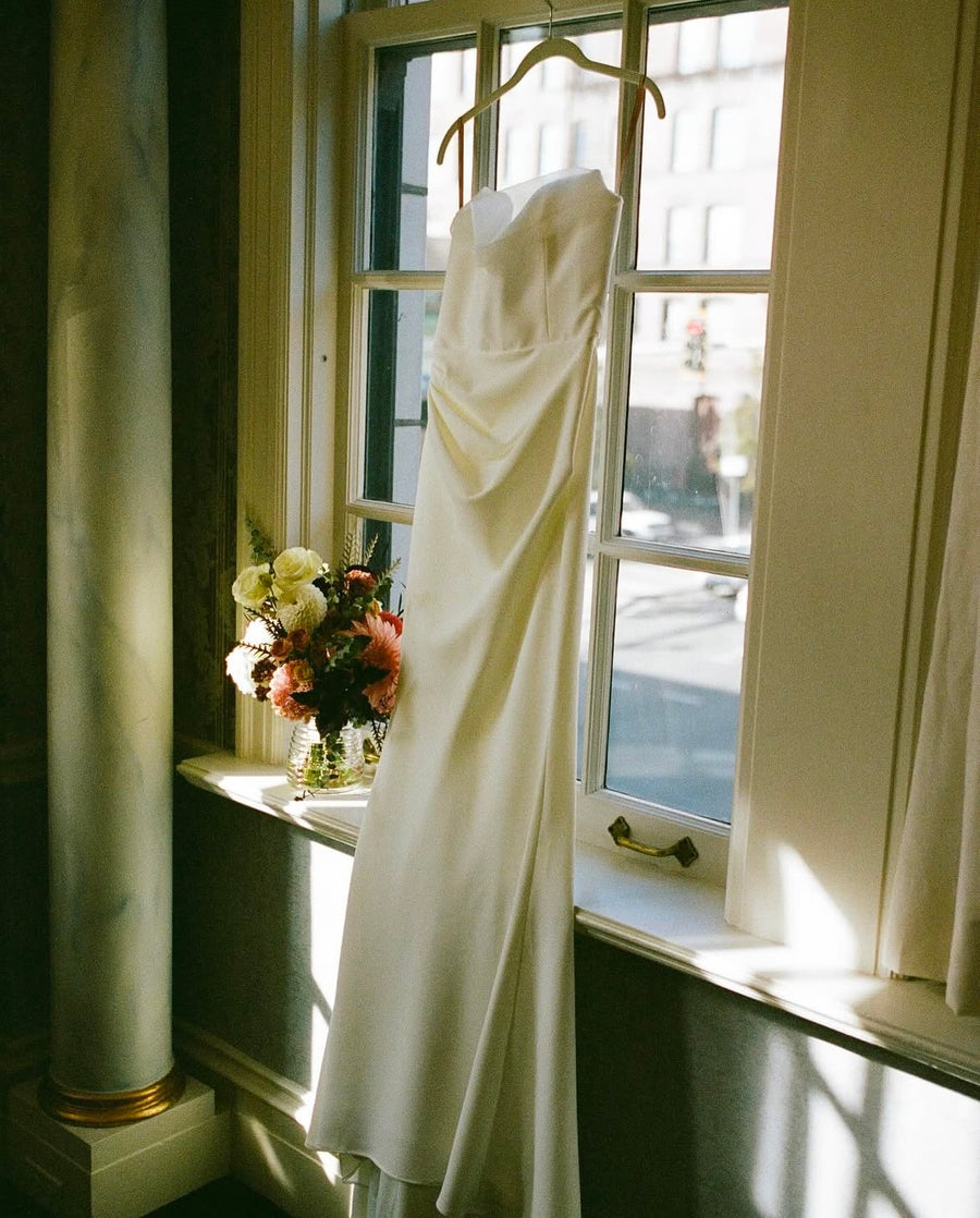Wedding dress and flower arrangement at the historic Davenport Hotel wedding suite.