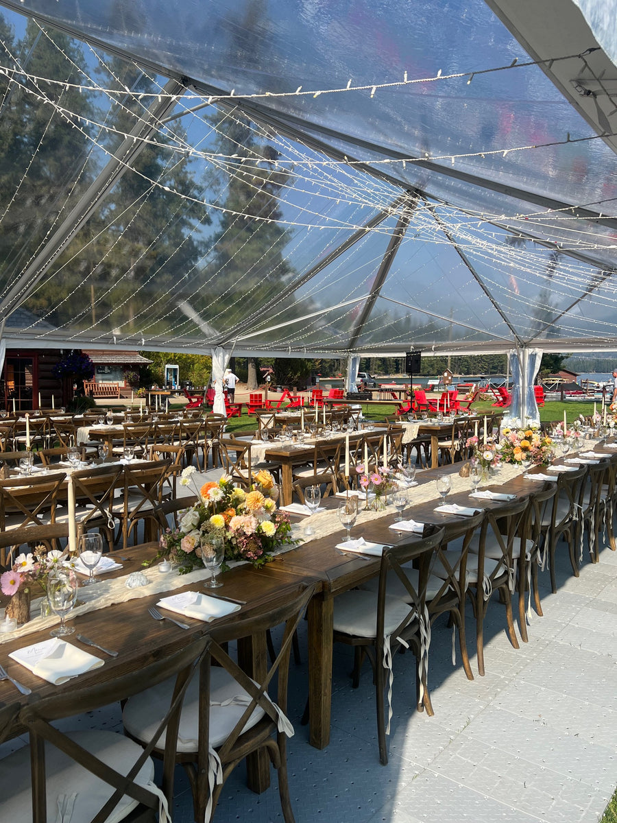 Lakeside wedding reception with flower centerpieces by Spokane wedding florist Daisies in May