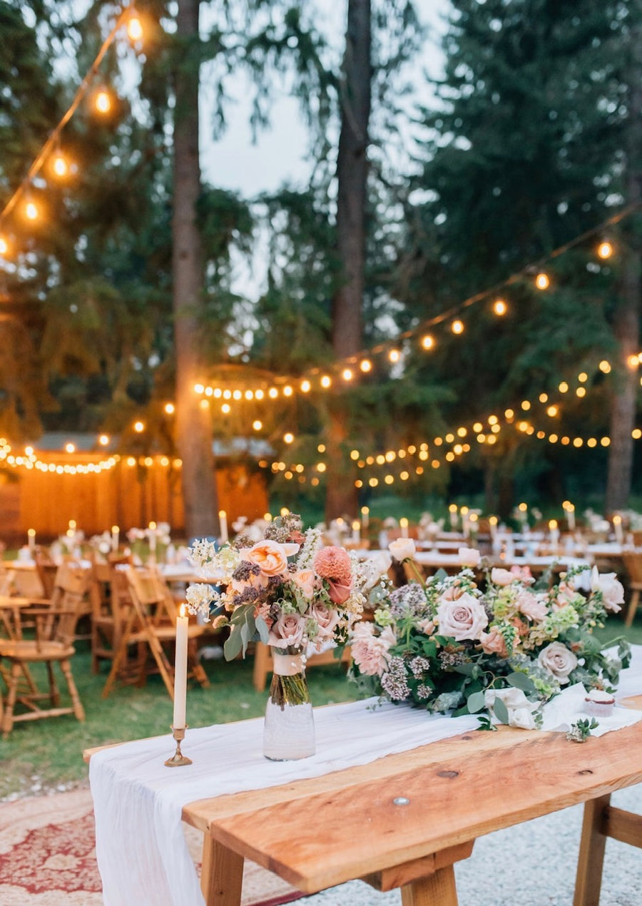 Soft tones of peach, lavender, cream and pink for a back yard wedding. Lovely flower arrangements by Spokane florist Daisies in May