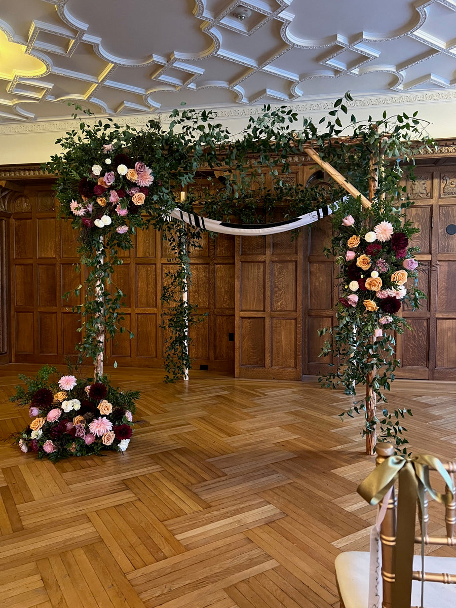 Rustic wildflower adorned Chuppah in the historic Davenport Hotel in the Elizabethan Room. Wedding Chuppah inspiration