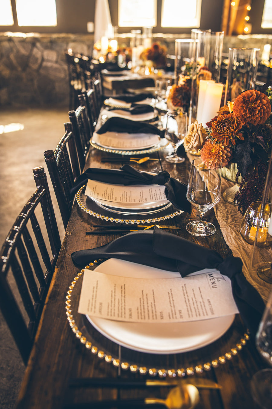 Autumn wedding reception with elegant place settings and fall floral arrangements in Spokane, WA