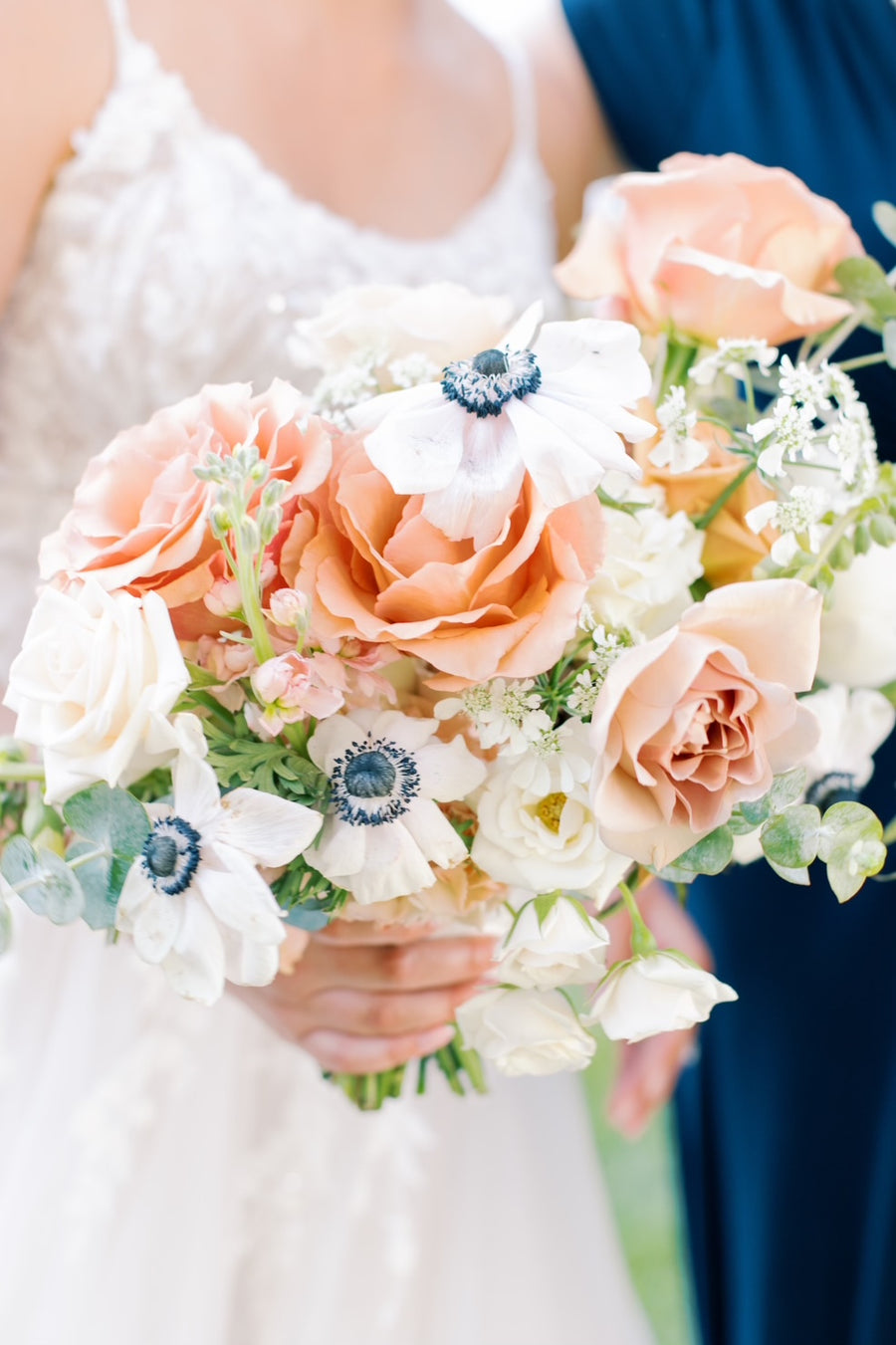 Peach, blue and white wedding bouquet by Daisies in May wedding florist in Spokane, WA