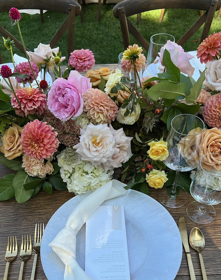 Sweetheart table dripping with wildflowers and hydrangeas by Daisies in May